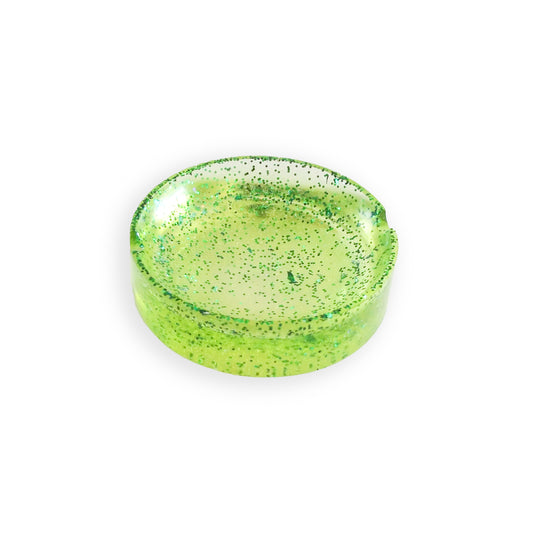 Image of a sparkling green CanEmpire resin ashtray from CanArt collection. This handcrafted piece made of eco-friendly resin offers heat protection as well as unmatched style & durability.